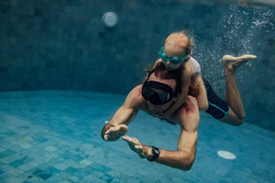 Professional swimmer diving into the pool